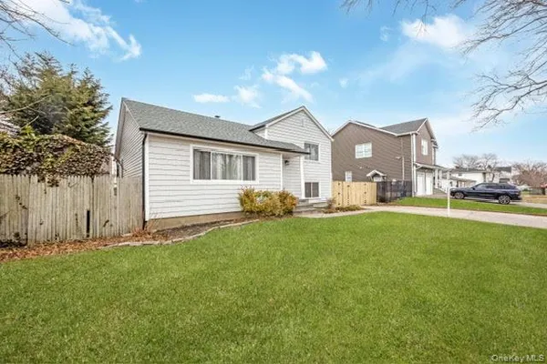 a view of a house with a back yard