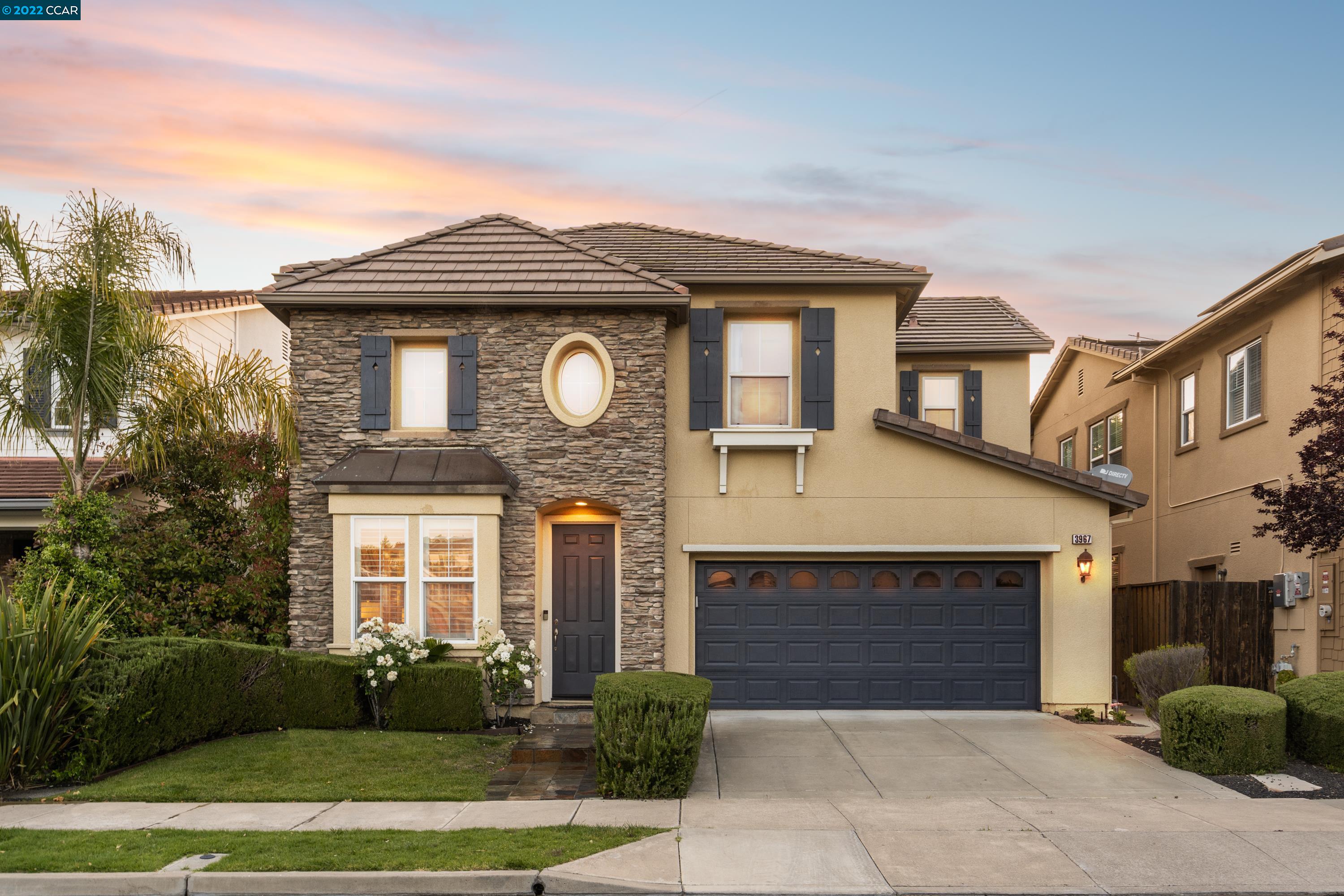 3967 Veritas Way San Ramon, CA 94582 - Photo 1 of 1 a front view of a house with a garden and plants