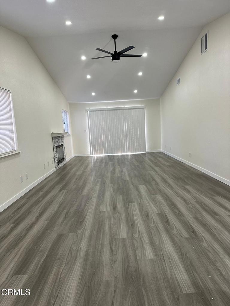 44839 16th Street East Lancaster, CA 93535 - Photo 27 of 53 an empty room with wooden floor and windows