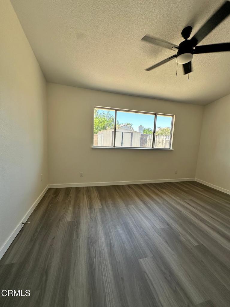 44839 16th Street East Lancaster, CA 93535 - Photo 30 of 53 wooden floor in an empty room with a window