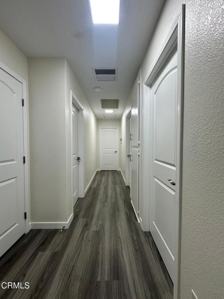 44839 16th Street East Lancaster, CA 93535 - Photo 33 of 53 a view of hallway with wooden floor