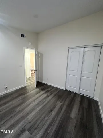 a white toilet sitting next to a bathroom sink and tub