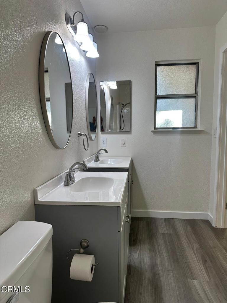 44839 16th Street East Lancaster, CA 93535 - Photo 44 of 53 a bathroom with a toilet sink and mirror