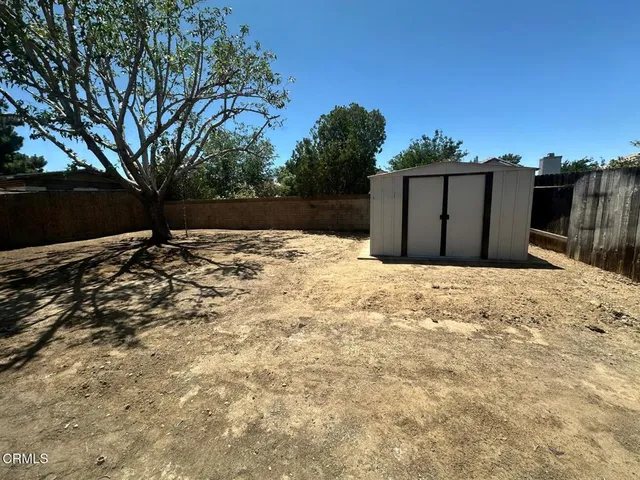 a view of backyard with green space