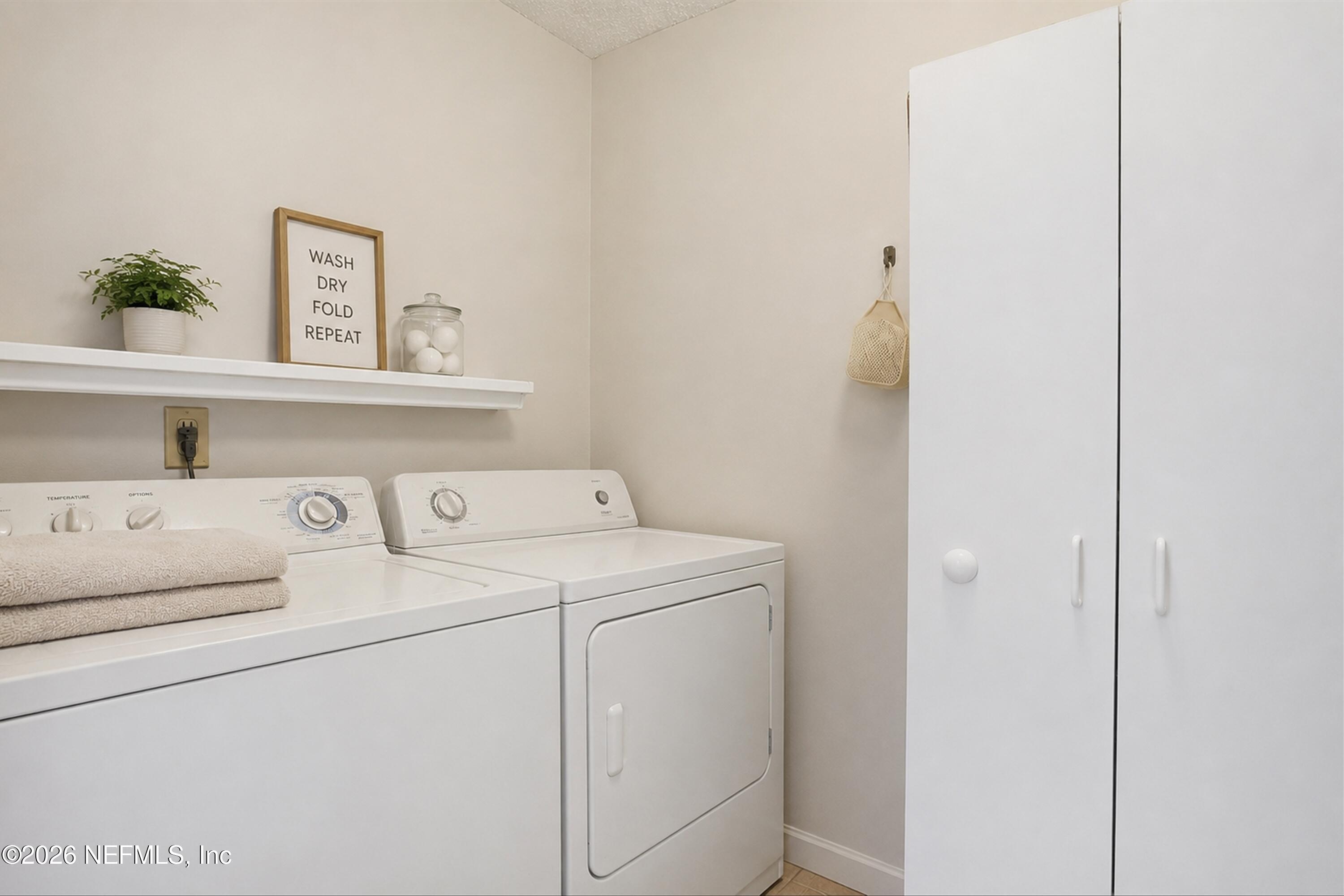 124 Hopkins Street Neptune Beach, FL 32266 - Photo 22 of 44 a utility room with dryer and washer