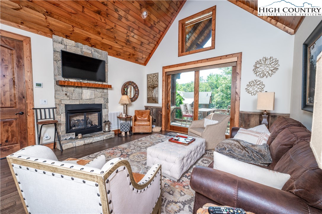 16 Camp Eagle Loop Banner Elk, NC 28604 - Photo 12 of 23 a living room with furniture a fireplace and a flat screen tv