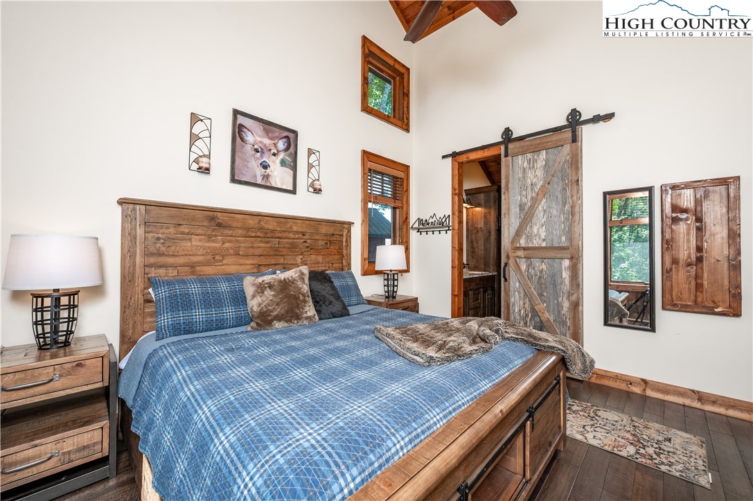 16 Camp Eagle Loop Banner Elk, NC 28604 - Photo 18 of 23 a bedroom with a large bed and a lamp