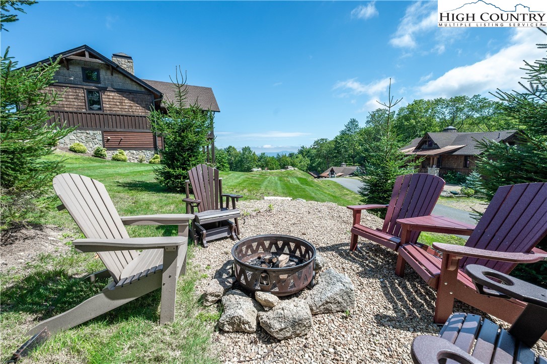 16 Camp Eagle Loop Banner Elk, NC 28604 - Photo 5 of 23 a view of a chairs and table in the patio