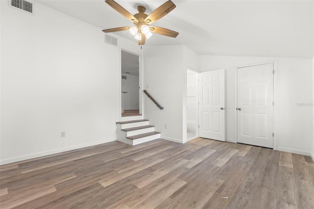 3723 Temple Street Tampa, FL 33619 - Photo 11 of 28 wooden floor in an empty room with a window