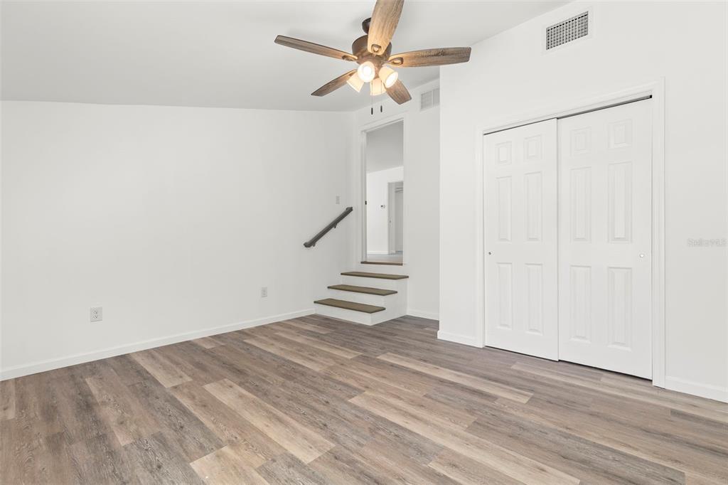 3723 Temple Street Tampa, FL 33619 - Photo 23 of 28 a view of an empty room with a ceiling fan