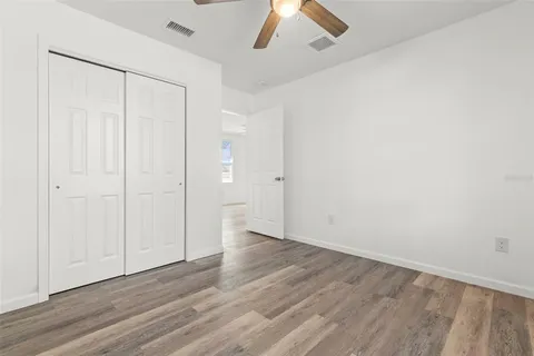 an empty room with wooden floor