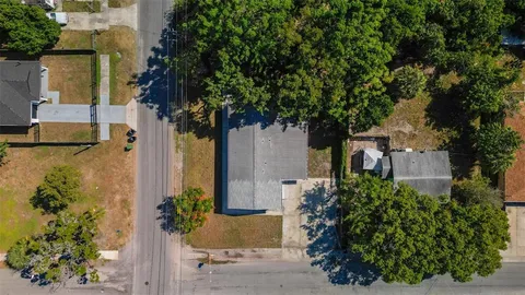 front view of a house with a tree
