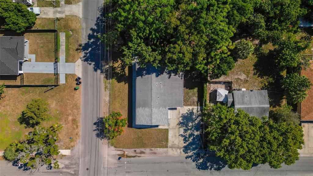 3723 Temple Street Tampa, FL 33619 - Photo 28 of 28 front view of a house with a tree