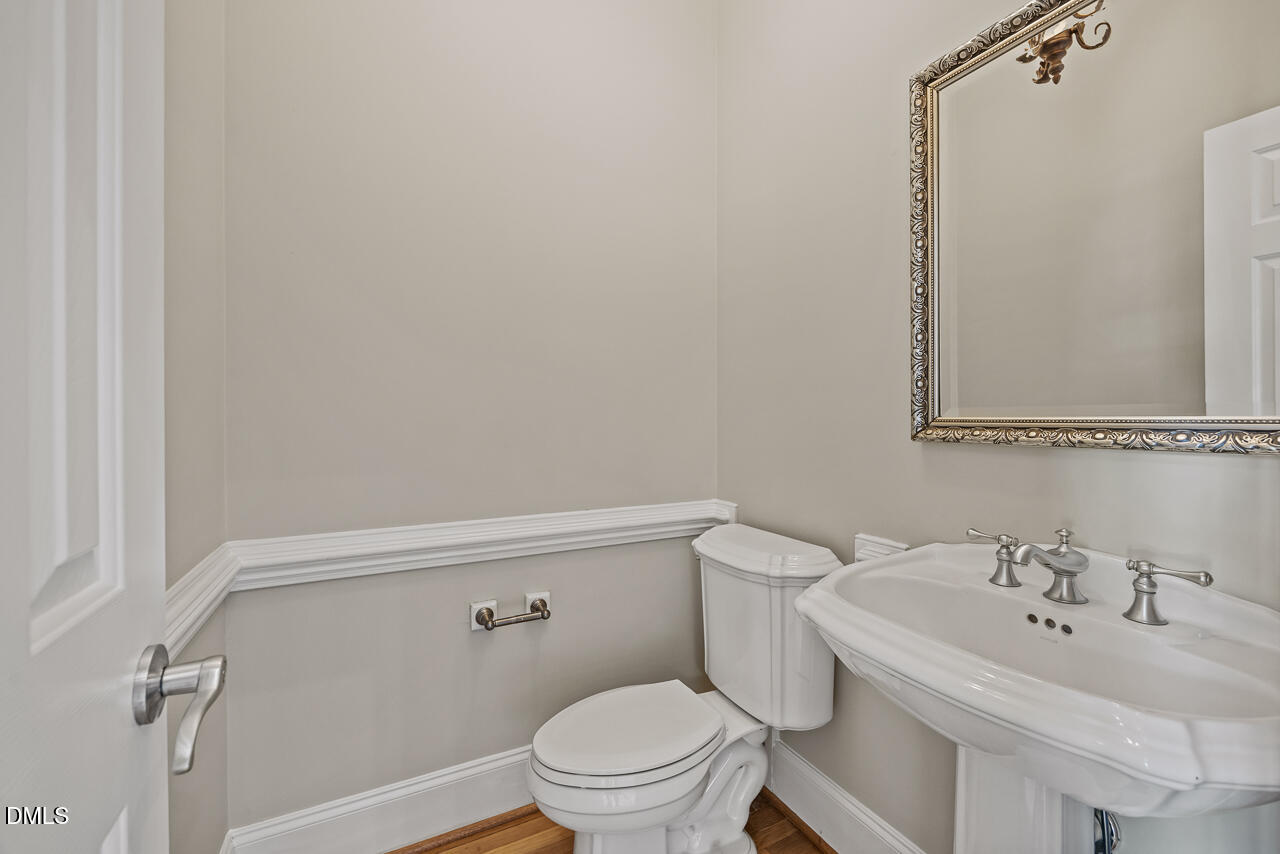 4004 Frontenac Court Apex, NC 27539 - Photo 10 of 61 a bathroom with a sink and a toilet