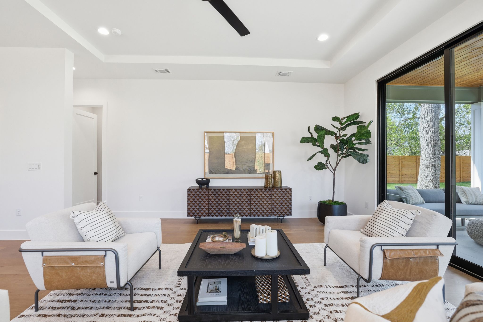 4500 Jinx Avenue Austin, TX 78745 - Photo 20 of 40 Living area with a raised ceiling, wood finished floors, ceiling fan, and recessed lighting