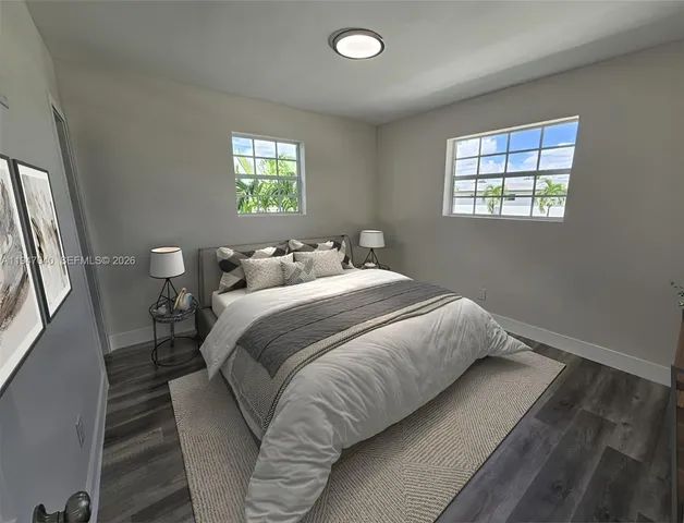 a bedroom with a bed and window