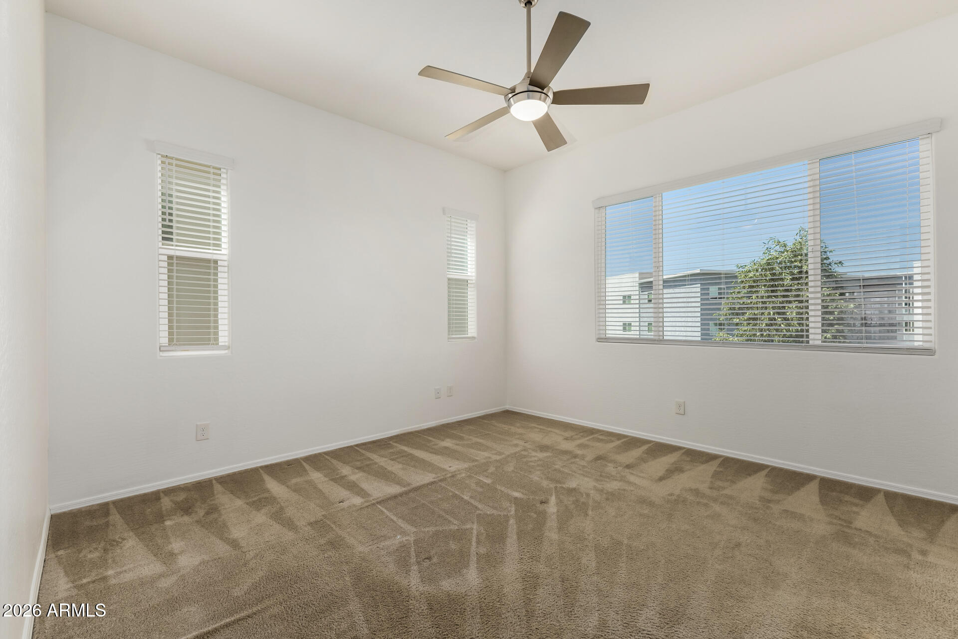 7358 West Phelps Road Peoria, AZ 85382 - Photo 14 of 28 a view of an empty room with a window