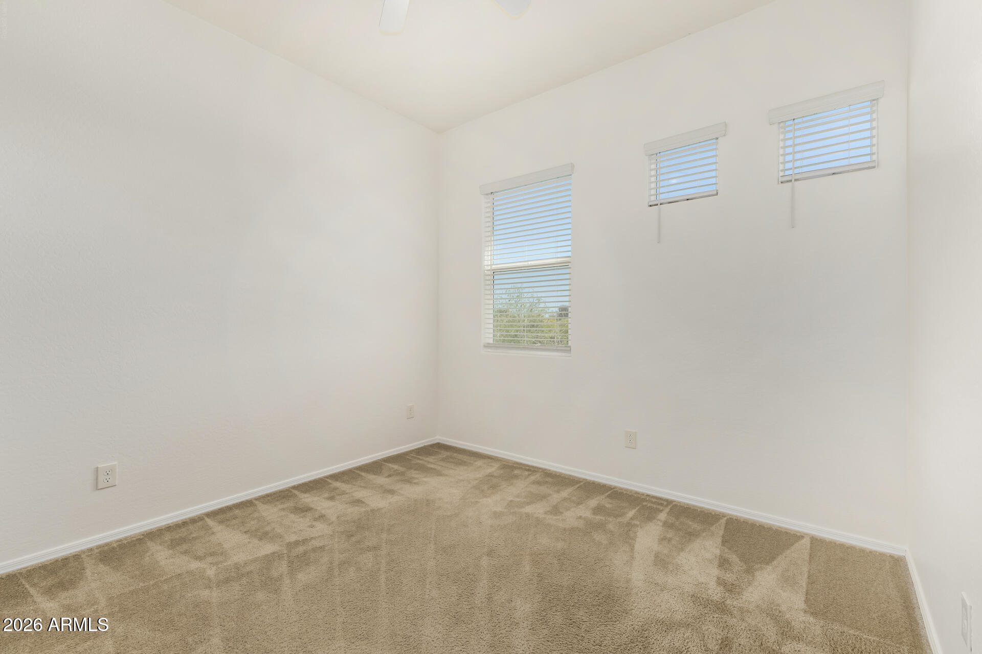 7358 West Phelps Road Peoria, AZ 85382 - Photo 17 of 28 a view of an empty room