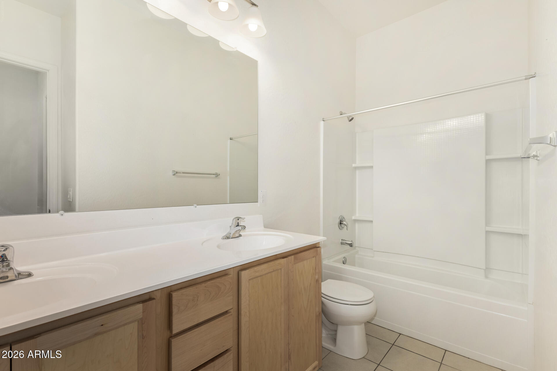 7358 West Phelps Road Peoria, AZ 85382 - Photo 20 of 28 a bathroom with a sink a toilet and shower