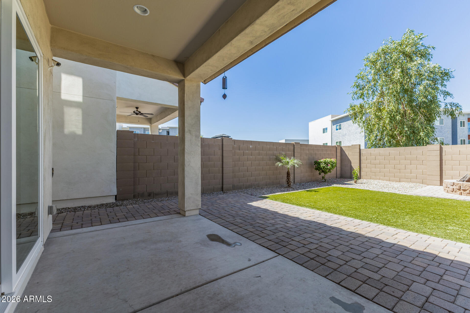 7358 West Phelps Road Peoria, AZ 85382 - Photo 22 of 28 a view of a backyard with furniture and a garage