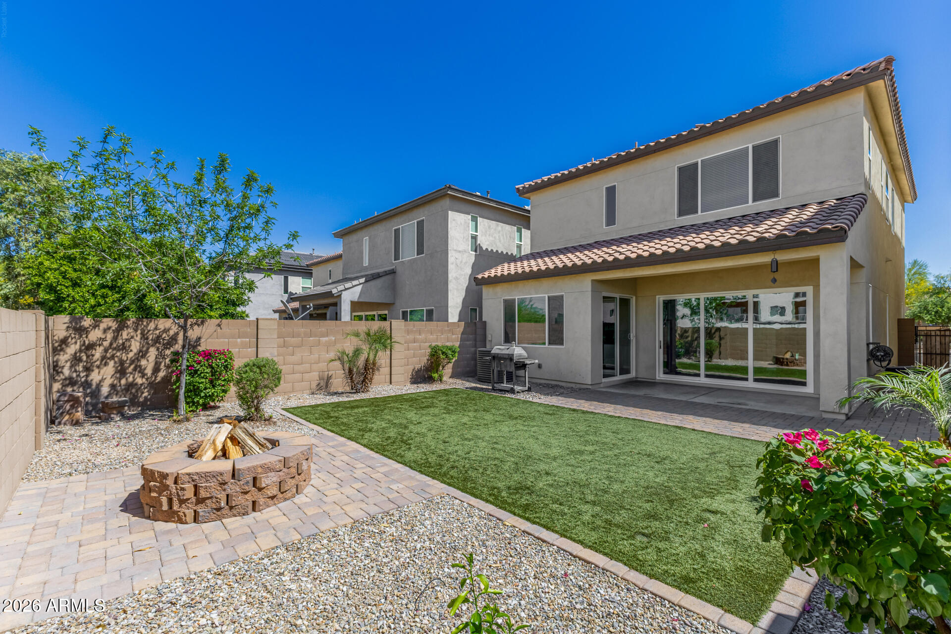 7358 West Phelps Road Peoria, AZ 85382 - Photo 24 of 28 a front view of a house with a yard