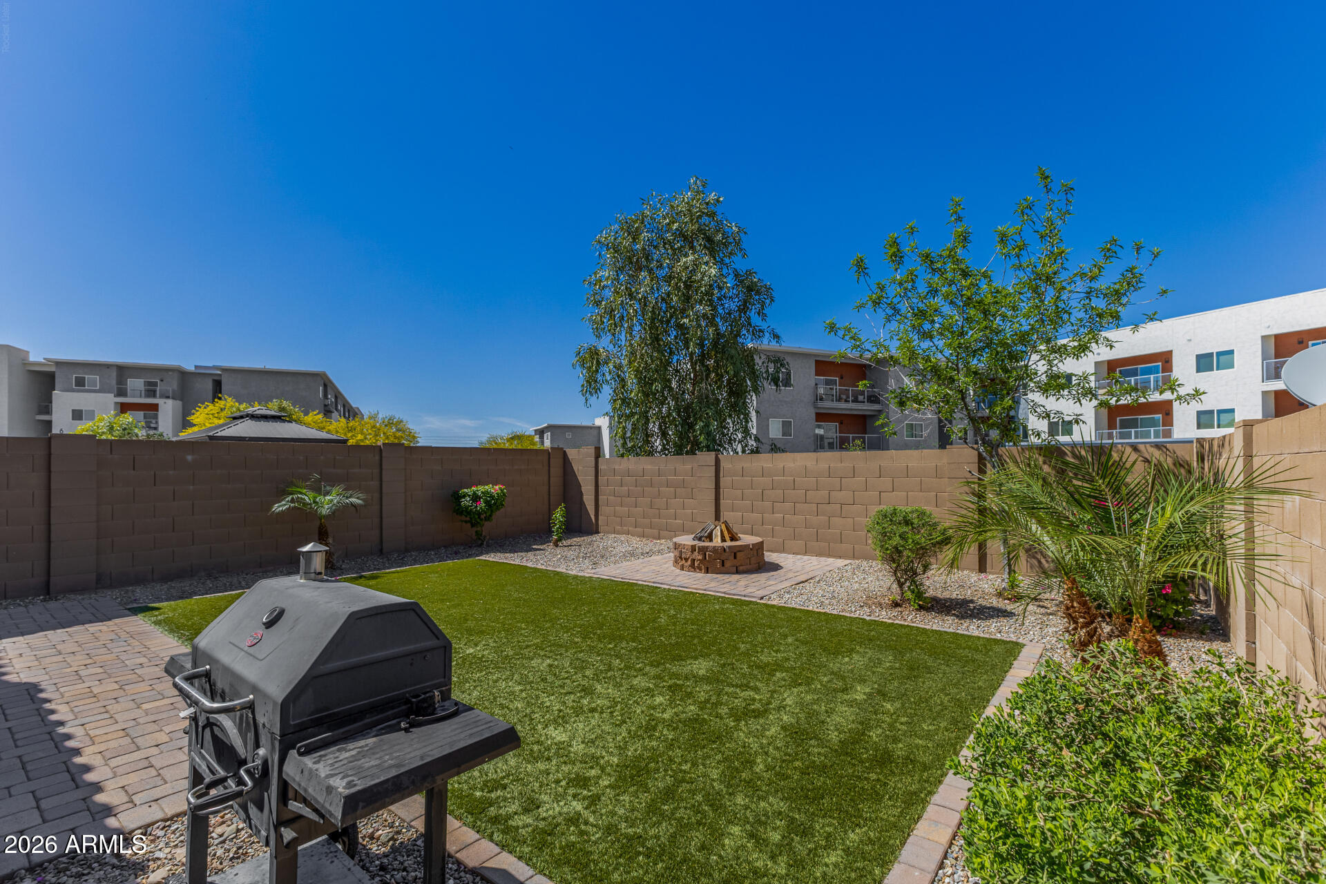 7358 West Phelps Road Peoria, AZ 85382 - Photo 28 of 28 a backyard of a house with table and chairs