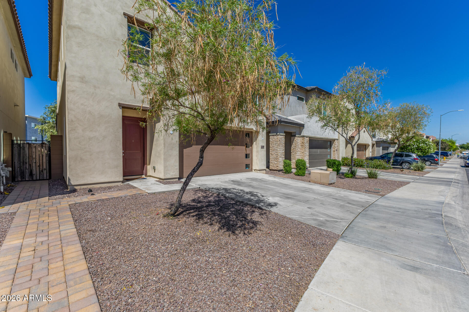 7358 West Phelps Road Peoria, AZ 85382 - Photo 3 of 28 a view of a street with houses