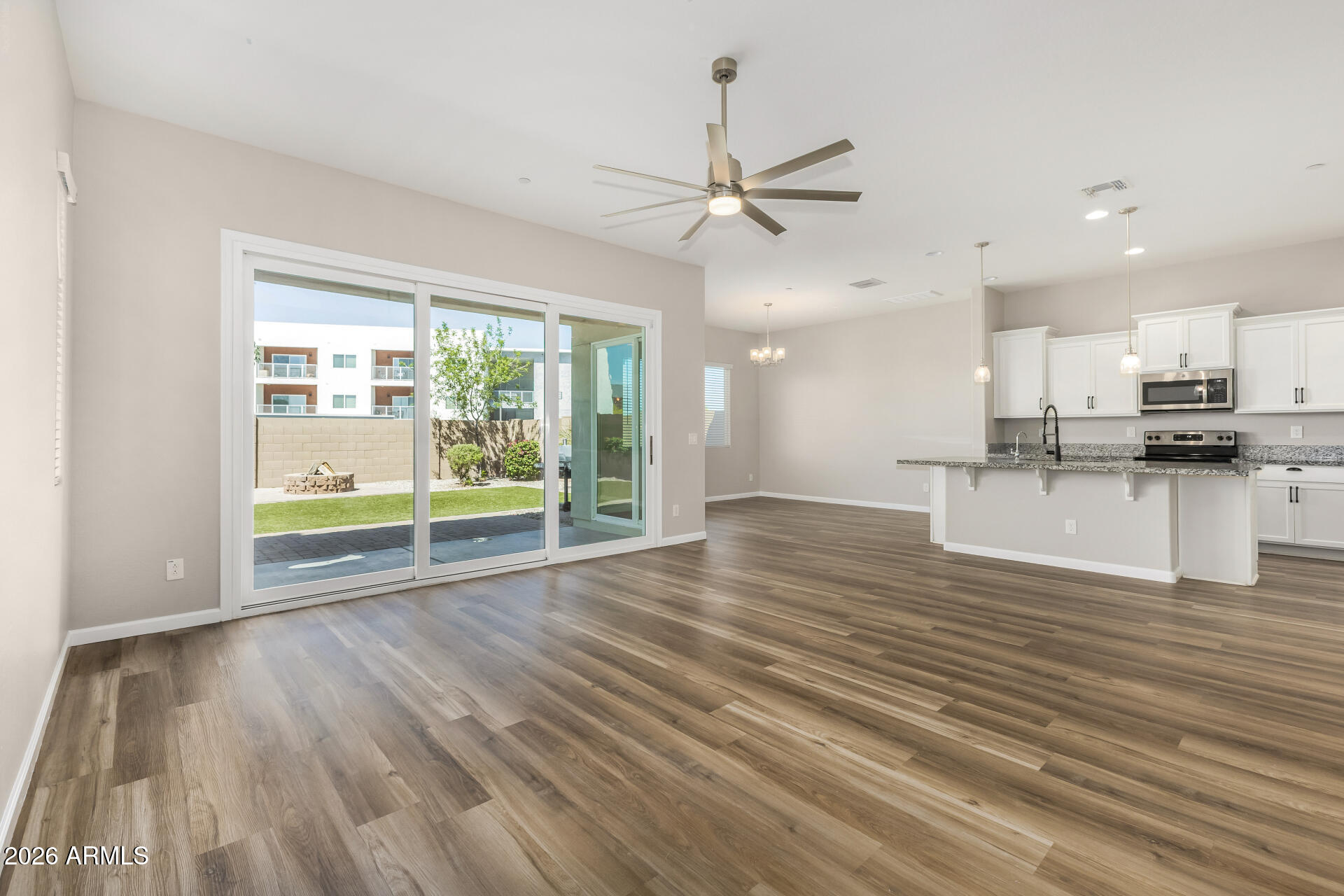 7358 West Phelps Road Peoria, AZ 85382 - Photo 5 of 28 a view of kitchen and wooden floor