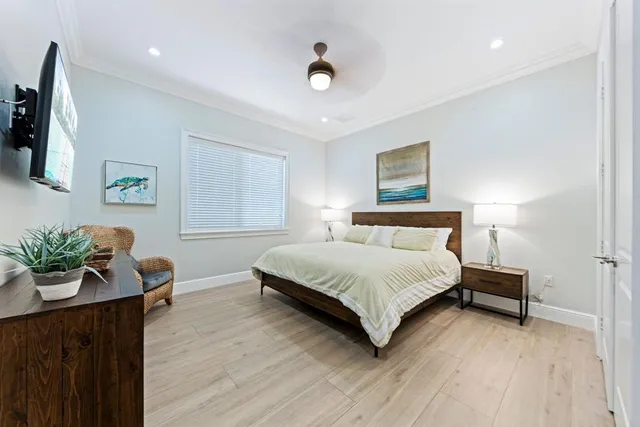 a bedroom with a bed and flat screen tv