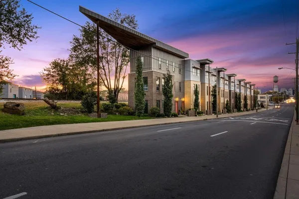 a view of a street with a building in the background