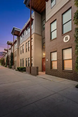 a pathway of a house with a yard