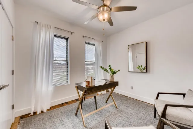 a workspace with furniture and window