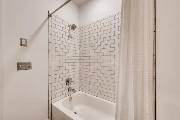 a bathroom with a white bath tub