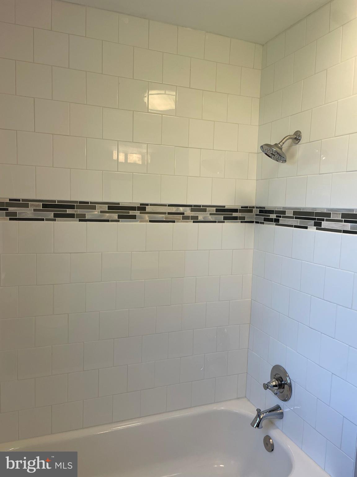 5 Oak Street Cambridge, MD 21613 - Photo 20 of 31 a bathroom with a shower