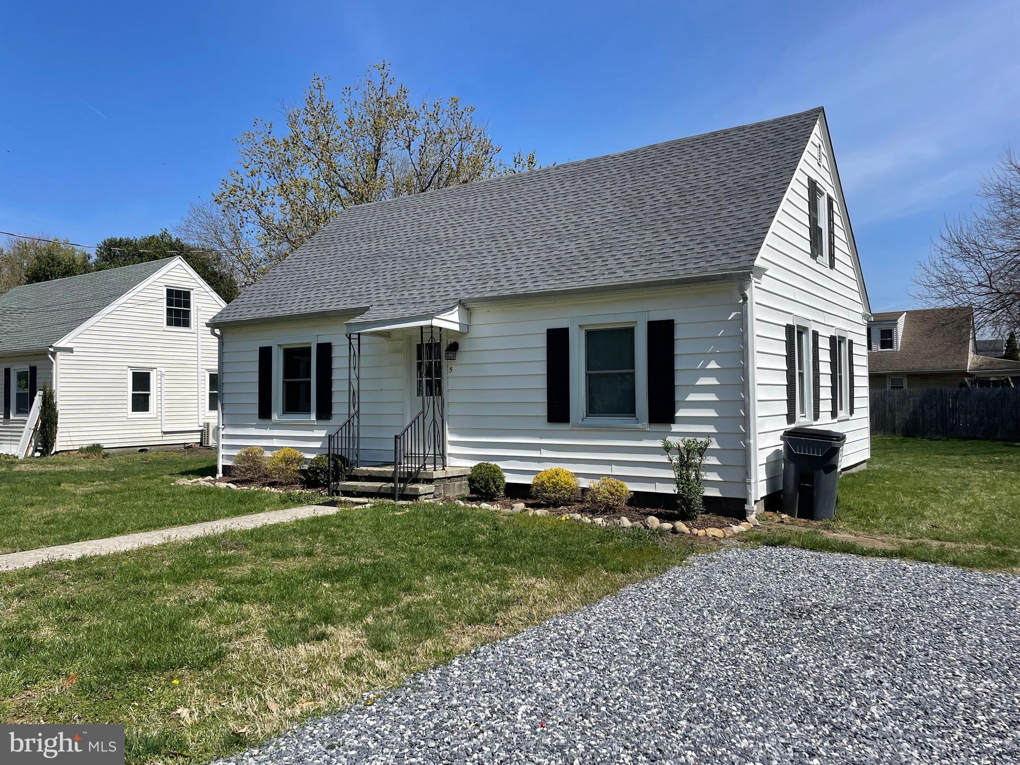 5 Oak Street Cambridge, MD 21613 - Photo 2 of 31 front view of a house with a yard