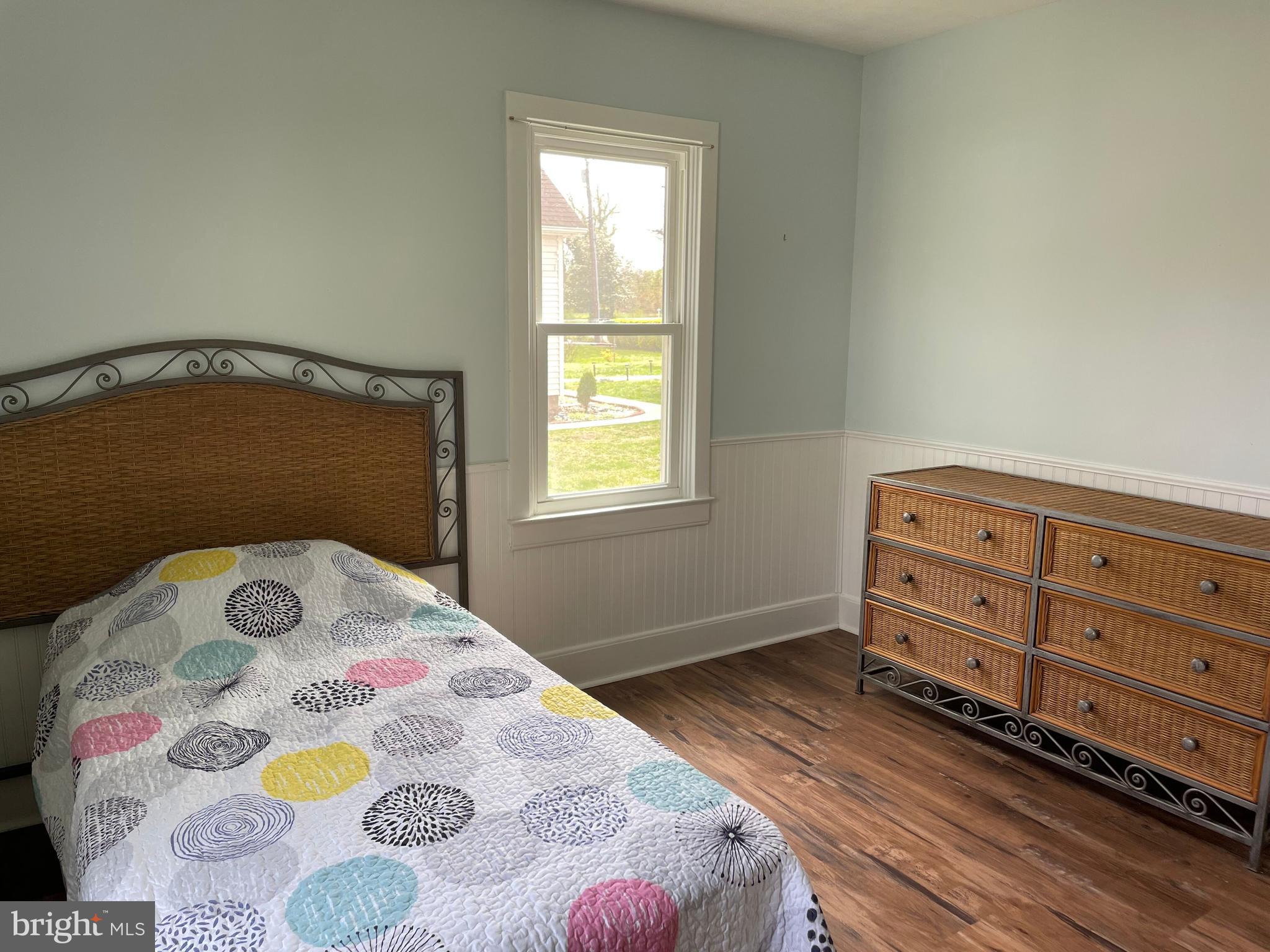 5 Oak Street Cambridge, MD 21613 - Photo 27 of 31 a bedroom with a bed and a window