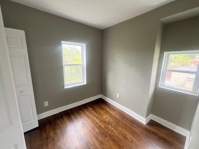 358 Pointview Road Pittsburgh, PA 15227 - Photo 10 of 12 an empty room with wooden floor and windows