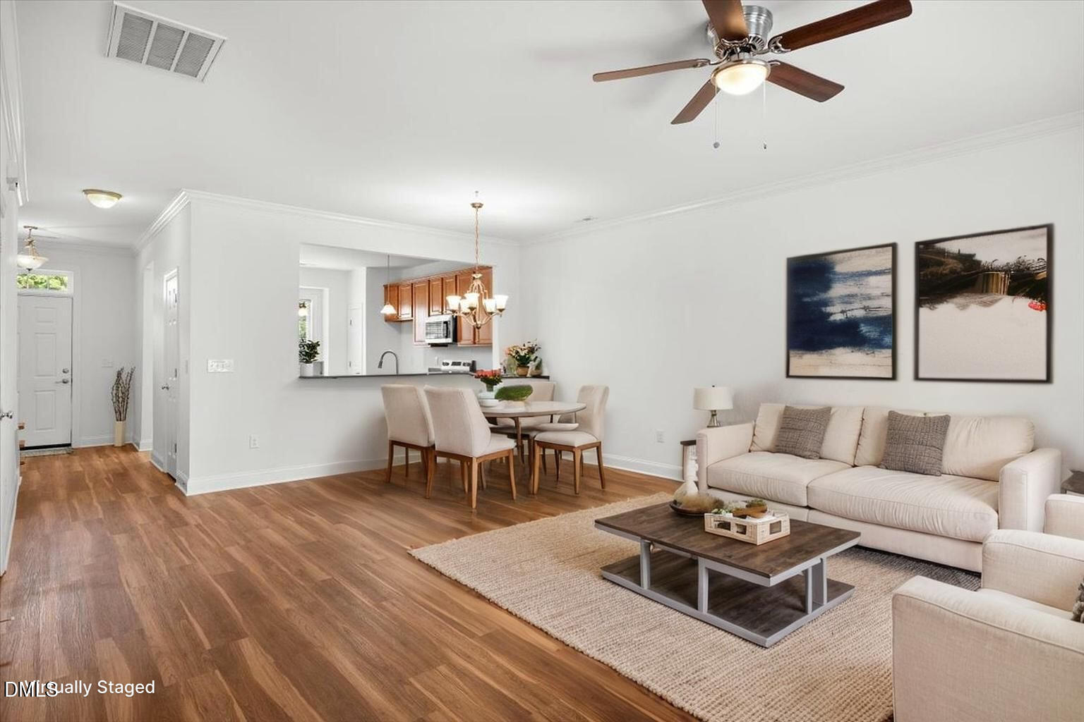 305 West Savannah Ridge Road Holly Springs, NC 27540 - Photo 13 of 34 a living room with furniture and a wooden floor