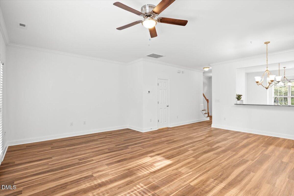 305 West Savannah Ridge Road Holly Springs, NC 27540 - Photo 16 of 34 a view of empty room with wooden floor and fan