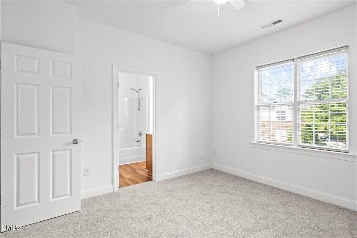 305 West Savannah Ridge Road Holly Springs, NC 27540 - Photo 20 of 34 a view of an empty room with a window