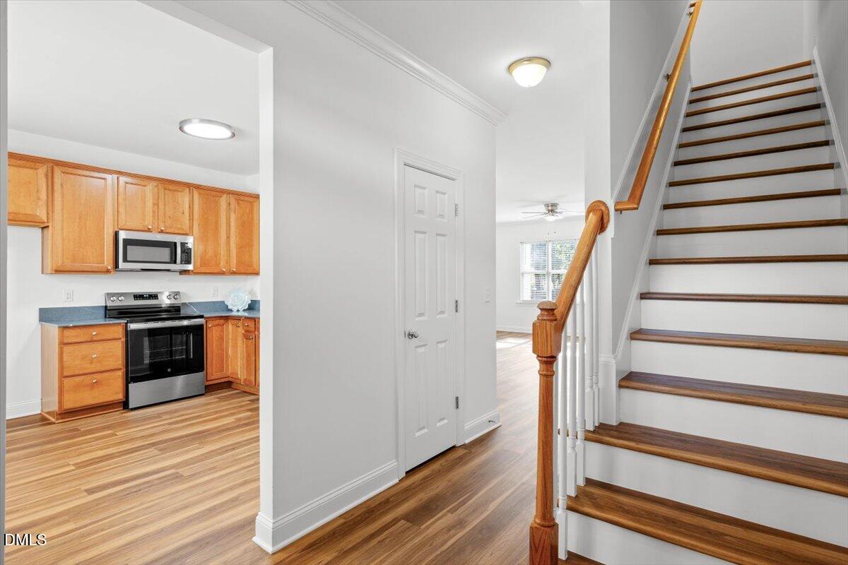 305 West Savannah Ridge Road Holly Springs, NC 27540 - Photo 2 of 34 a view of kitchen with sink and stainless steel appliances