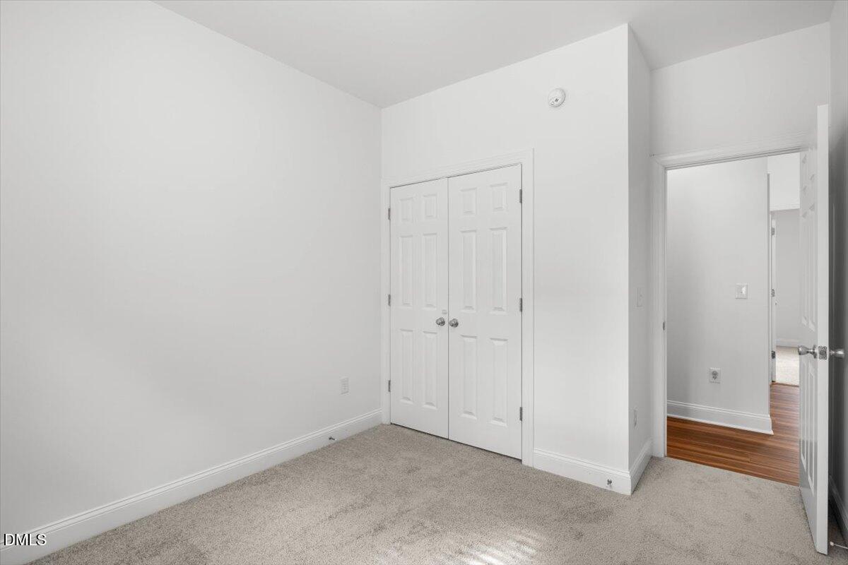 305 West Savannah Ridge Road Holly Springs, NC 27540 - Photo 27 of 34 a view of an empty room