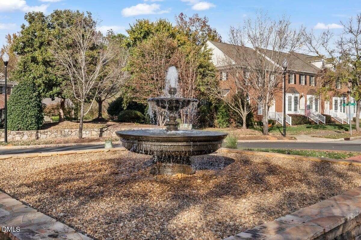 305 West Savannah Ridge Road Holly Springs, NC 27540 - Photo 34 of 34 a view of a fountain in the middle of a city