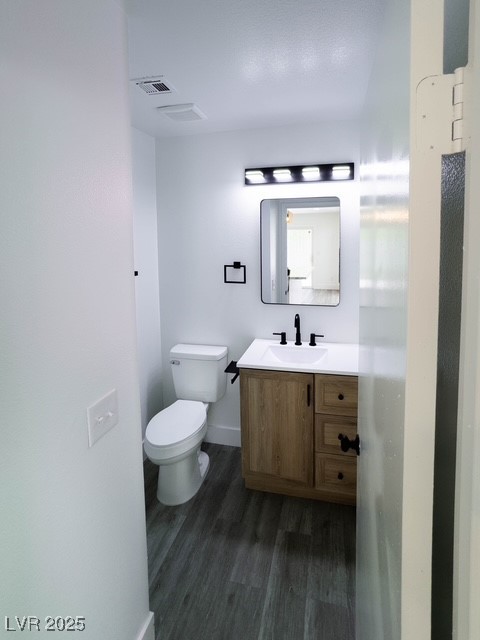 3686 Lincoln Road Las Vegas, NV 89115 - Photo 12 of 26 Half bathroom featuring wood finished floors, visi