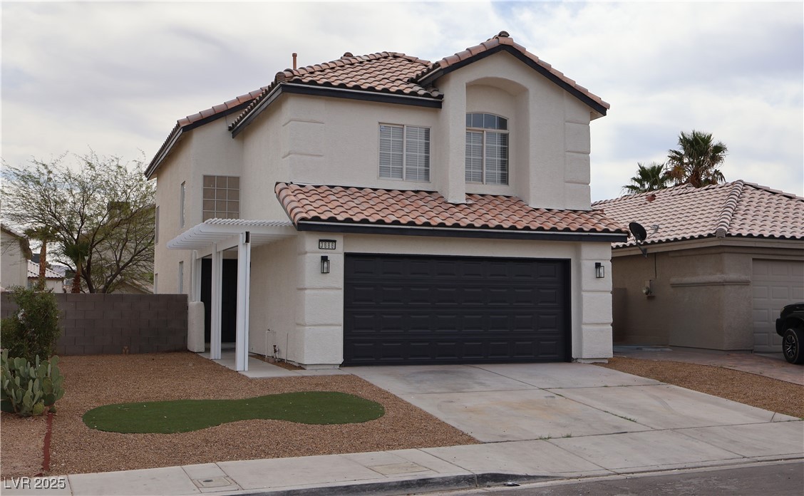 3686 Lincoln Road Las Vegas, NV 89115 - Photo 3 of 26 Mediterranean / spanish home featuring a garage, s