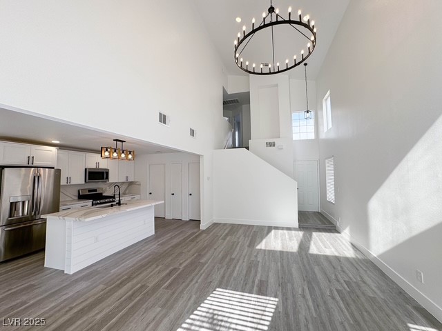 3686 Lincoln Road Las Vegas, NV 89115 - Photo 8 of 26 Kitchen with a chandelier, wood finished floors, a