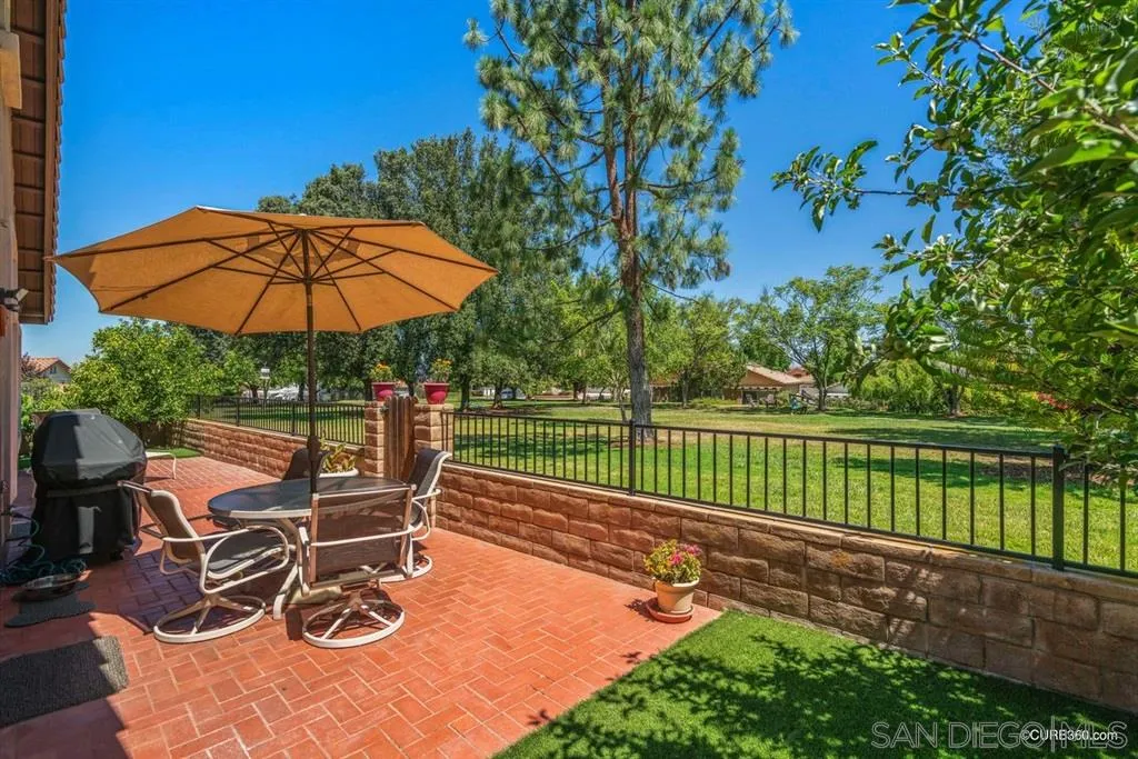 2332 Columbine Road Alpine, CA 91901 - Photo 17 of 25 a view of a patio with a table chairs and a umbrella