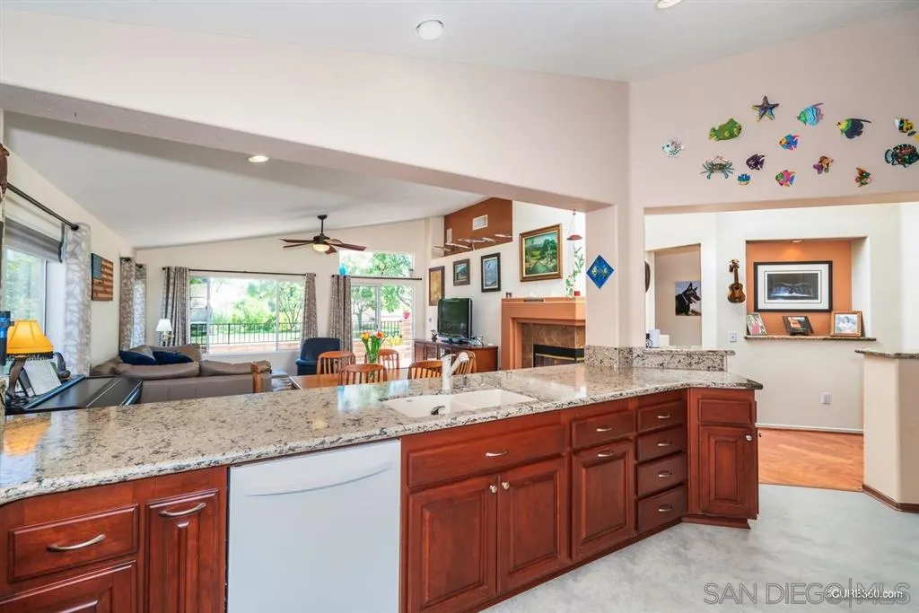 2332 Columbine Road Alpine, CA 91901 - Photo 2 of 25 a kitchen with granite countertop a sink stove and cabinets