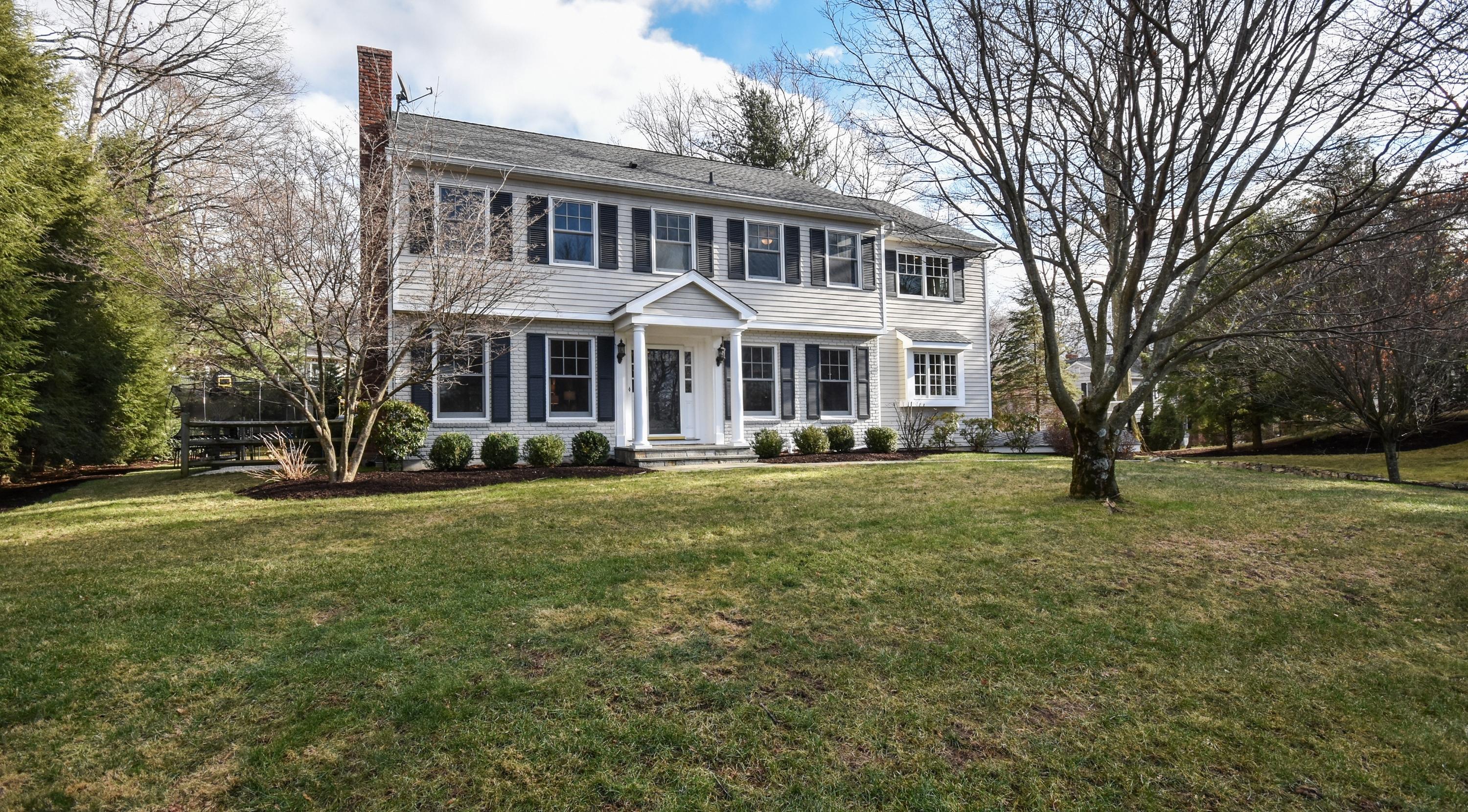 10 Barringer Road Darien, CT 06820 - Photo 1 of 27 a front view of a house with a garden