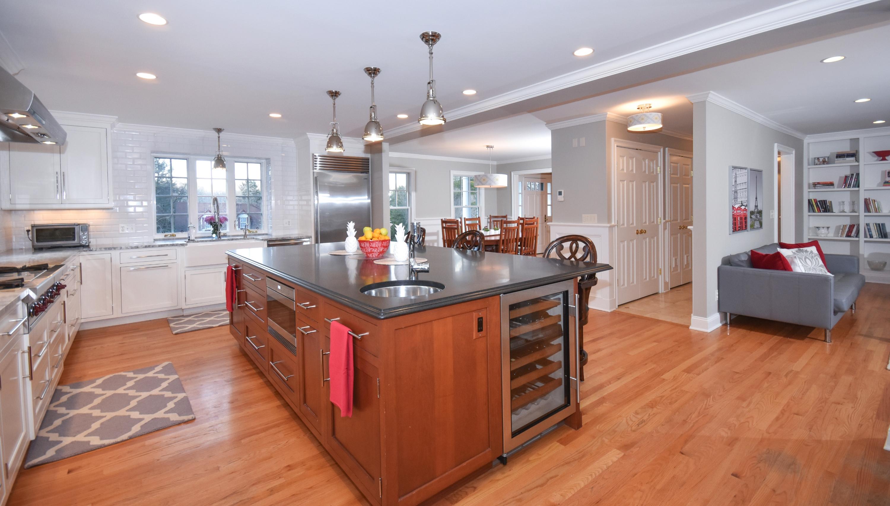 10 Barringer Road Darien, CT 06820 - Photo 11 of 27 a kitchen with kitchen island granite countertop a sink and a refrigerator